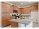 Eat-in kitchen island includes granite countertops, stainless steel appliances, and ample storage space at 4609 S 122Nd S Dr, Avondale, AZ 85323