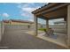 Inviting covered patio with outdoor seating, perfect for relaxing in the backyard at 4609 S 122Nd S Dr, Avondale, AZ 85323