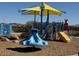 Colorful playground featuring a slide, climbing structure, and a yellow shade canopy at 4609 S 122Nd S Dr, Avondale, AZ 85323