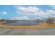 Scenic pond in the community with a pavilion and picnic tables, perfect for outdoor enjoyment at 4609 S 122Nd S Dr, Avondale, AZ 85323
