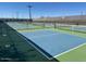 Well-maintained tennis and pickleball courts offer an active lifestyle in this gated community at 4609 S 122Nd S Dr, Avondale, AZ 85323