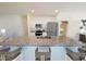 Modern kitchen with stainless steel appliances, granite countertops, and a breakfast bar at 6130 E Artemis Dr, Florence, AZ 85132