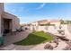 Beautiful backyard featuring a fountain, patio, artificial turf, and desert landscaping at 6202 E Mckellips Rd # 210, Mesa, AZ 85215