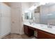 Bathroom featuring double sinks, white cabinets, and a large mirror offers modern comfort at 6202 E Mckellips Rd # 210, Mesa, AZ 85215