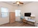 Bedroom featuring laminate wood floors, dual windows and a ceiling fan at 6202 E Mckellips Rd # 210, Mesa, AZ 85215