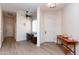 Inviting entryway with wood-look floors, a charming desk area, and neutral paint colors at 6202 E Mckellips Rd # 210, Mesa, AZ 85215