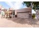 Elegant home showcasing a private two-car garage and beautiful brick-paved driveway at 6202 E Mckellips Rd # 210, Mesa, AZ 85215