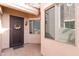 Inviting entryway with a decorative door, charming wreath, and well-lit porch area at 6202 E Mckellips Rd # 210, Mesa, AZ 85215
