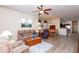 Open-concept living room with hardwood floors and an inviting dining area is bright and airy at 6202 E Mckellips Rd # 210, Mesa, AZ 85215