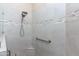 Shower with neutral tile and grab bar offers a safe and serene space at 6202 E Mckellips Rd # 210, Mesa, AZ 85215