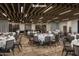 Elegant ballroom featuring tables set for an event, wood beams, and ample seating at 6514 E Crested Saguaro Ln, Scottsdale, AZ 85266