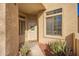 Welcoming front entrance with security door and decorative wreath in a cozy covered entryway at 6730 E Hermosa Vista Dr # 73, Mesa, AZ 85215