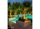 Backyard pool with built-in planters, wall-mounted water features and landscape lighting at 7242 E Joshua Tree Ln, Scottsdale, AZ 85250