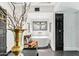 Bathroom boasts a freestanding tub, a decorative chair, and dark hardwood floors at 7242 E Joshua Tree Ln, Scottsdale, AZ 85250