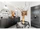 Bathroom features a double vanity with vessel sinks, sleek black cabinetry, and artistic decor at 7242 E Joshua Tree Ln, Scottsdale, AZ 85250