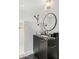 Modern bathroom with a shower area, sleek vanity, marble countertop, and well-placed fixtures at 7242 E Joshua Tree Ln, Scottsdale, AZ 85250