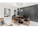Contemporary dining room features a black table, leather chairs, and unique ceiling detail at 7242 E Joshua Tree Ln, Scottsdale, AZ 85250