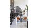 Bright entryway with elegant staircase, stylish decor, and eye-catching artwork at 7242 E Joshua Tree Ln, Scottsdale, AZ 85250