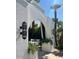 Charming outdoor lounge area entrance with distinctive architectural design and lush landscaping at 7242 E Joshua Tree Ln, Scottsdale, AZ 85250