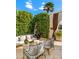 Inviting outdoor space with comfortable seating, lush greenery, and a stylish, modern design at 7242 E Joshua Tree Ln, Scottsdale, AZ 85250