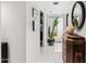 Stylish hallway with modern decor, decorative cactus, and access to the outdoor patio area at 7242 E Joshua Tree Ln, Scottsdale, AZ 85250