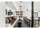 Open hallway features hardwood floors, a comfortable seating area, and artful display shelving at 7242 E Joshua Tree Ln, Scottsdale, AZ 85250