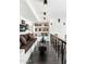 A hallway features a built-in sofa and shelving with art objects creating a stylish and functional space at 7242 E Joshua Tree Ln, Scottsdale, AZ 85250