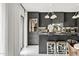 Modern kitchen with sleek, dark cabinetry, marble countertops, and stainless steel appliances at 7242 E Joshua Tree Ln, Scottsdale, AZ 85250