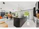 Expansive kitchen featuring a large island, and a dining area at 7242 E Joshua Tree Ln, Scottsdale, AZ 85250