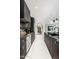 Modern kitchen with dark cabinetry, marble countertops, and an open layout at 7242 E Joshua Tree Ln, Scottsdale, AZ 85250