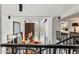 View from the staircase overlooking the two-story living room, showcasing its elegant design and furnishings at 7242 E Joshua Tree Ln, Scottsdale, AZ 85250