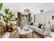 Living room boasts sliding glass doors, a modern screen wall, and stylish furnishings at 7242 E Joshua Tree Ln, Scottsdale, AZ 85250
