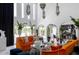 Elegant living area featuring high ceilings, pendant lights, and comfortable, colorful seating at 7242 E Joshua Tree Ln, Scottsdale, AZ 85250