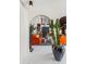A living room showcases a decorative archway, modern decor, and orange sofas creating a vibrant and inviting space at 7242 E Joshua Tree Ln, Scottsdale, AZ 85250