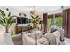 Living room with sliding glass doors, a decorative console, and eclectic decor at 7242 E Joshua Tree Ln, Scottsdale, AZ 85250