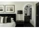 Stylish main bedroom with elegant decor, chic lighting, and artwork, creating a serene and inviting atmosphere at 7242 E Joshua Tree Ln, Scottsdale, AZ 85250