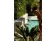 Beautiful pool features water fountain features, lush greenery, and a relaxing ambiance at 7242 E Joshua Tree Ln, Scottsdale, AZ 85250