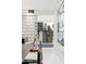 View of the modern staircase adjacent to the dining area with decorative block wall at 7242 E Joshua Tree Ln, Scottsdale, AZ 85250