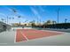 Well-maintained tennis court surrounded by palm trees and resort-style landscaping at 7401 N Scottsdale Rd # 24, Paradise Valley, AZ 85253