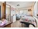 Cozy bedroom with natural light, comfortable seating, and an en suite bathroom at 7807 E Main St # Aa-8, Mesa, AZ 85207