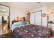 Bedroom featuring a comfortable bed and easy access to the hallway at 7807 E Main St # Aa-8, Mesa, AZ 85207