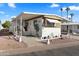 Charming home featuring a covered porch, landscaped yard, and delightful curb appeal at 7807 E Main St # Aa-8, Mesa, AZ 85207