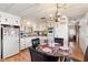 Bright kitchen with a dining nook, white appliances, and plenty of storage cabinets at 7807 E Main St # Aa-8, Mesa, AZ 85207