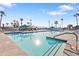 Community pool featuring pristine water, lounge chairs and mature palm trees in a tropical setting at 7807 E Main St # Aa-8, Mesa, AZ 85207