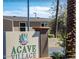 Community entrance sign at Agave Village, enhancing curb appeal with desert landscaping at 7807 E Main St # Aa-8, Mesa, AZ 85207