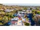 Gorgeous aerial view of property featuring desert landscaping, privacy hedges, and red tile roofing at 7841 N 18Th St, Phoenix, AZ 85020