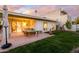 Spacious backyard featuring a patio, lush green lawn, and the exterior of the home at 7841 N 18Th St, Phoenix, AZ 85020