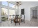 Bright dining area features a glass table set, a ceiling fan, and large windows at 7841 N 18Th St, Phoenix, AZ 85020