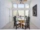 Bright dining area features a glass table set, a ceiling fan, and large windows at 7841 N 18Th St, Phoenix, AZ 85020