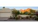 Well-maintained home with a two-car garage, desert landscaping, and beautiful mountain views at 7841 N 18Th St, Phoenix, AZ 85020